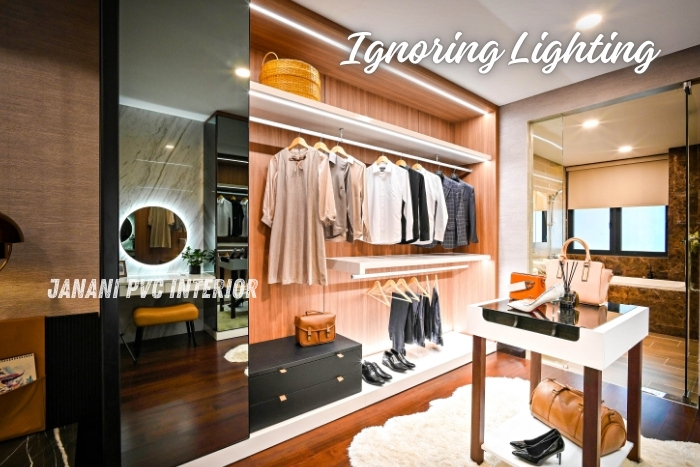 Transform Your Bedroom with PVC Wardrobe Solutions 3 Chic walk-in closet in Bengaluru featuring expertly integrated lighting by Janani PVC Interior, enhancing the visibility and ambiance of the space while showcasing a sleek and organized wardrobe setup